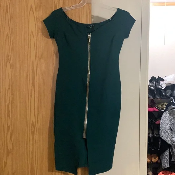 Hunter green with gold zipper in front